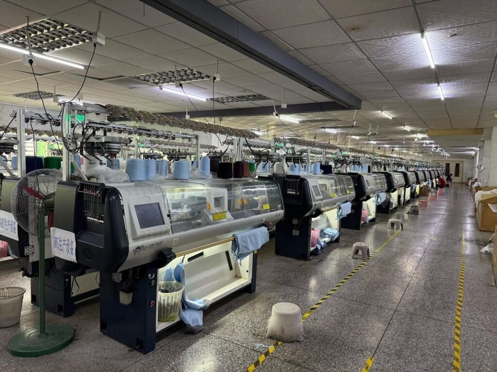 The heart of our operation: a glimpse into our state-of-the-art knitwear production floor. Here, precision machinery and dedicated craftsmanship converge in a streamlined process, ensuring every garment meets the highest standards of quality for our global clients.