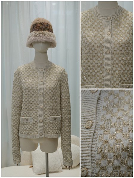 A tailored, double-breasted wool coat on a dress form, featuring a pronounced shawl collar and a sleek A-line silhouette. The piece embodies modern sophistication and precise custom tailoring.Focus on the intricate intarsia knitting technique on a sweater form, showcasing a multi-color geometric pattern with flawless color transitions and no dangling threads on the inside, a testament to superior craftsmanship.