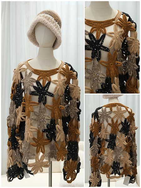 An extreme close-up on the sophisticated detail of a custom-knit cardigan. The image highlights the precise combination of a delicate popcorn stitch and a fine ribbed knit, creating a rich, tactile surface from 100% cashmere.