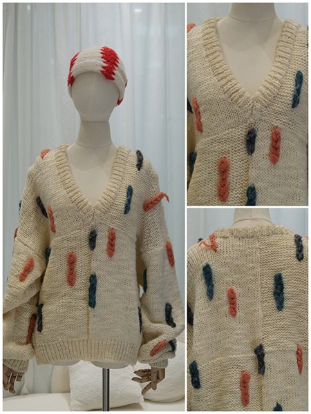 A dress form adorned with a bespoke, high-collar wool blend coat. The piece showcases intricate Aran cable knitting throughout, structured shoulders, and a tailored silhouette. The luxurious texture of the merino wool is evident, representing the pinnacle of custom craftsmanship.