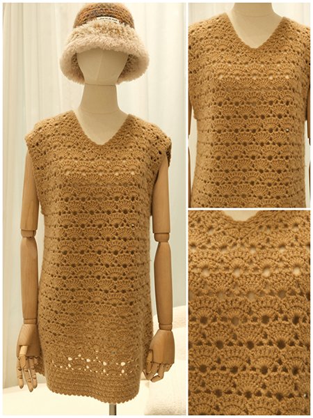 An extreme close-up on the sophisticated detail of a custom-knit cardigan. The image highlights the precise combination of a delicate popcorn stitch and a fine ribbed knit, creating a rich, tactile surface from 100% cashmere.