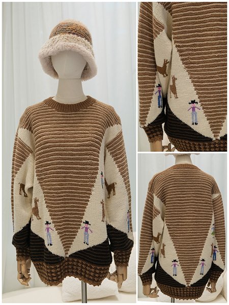 A curated shot of a dress form displaying an elegant, hand-knitted wool cape in a soft, neutral tone. Positioned in a minimalist studio setting with soft lighting, the image conveys a sense of timeless luxury and exclusive design.