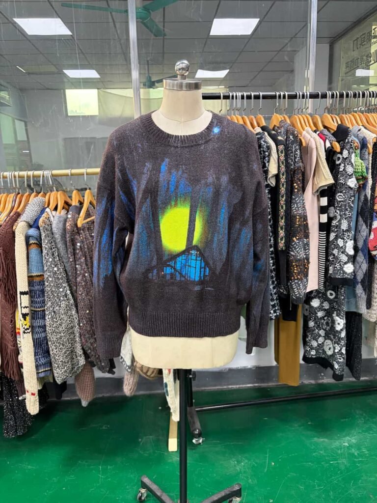 Artistic sweater with knits embroidery and sequin accents