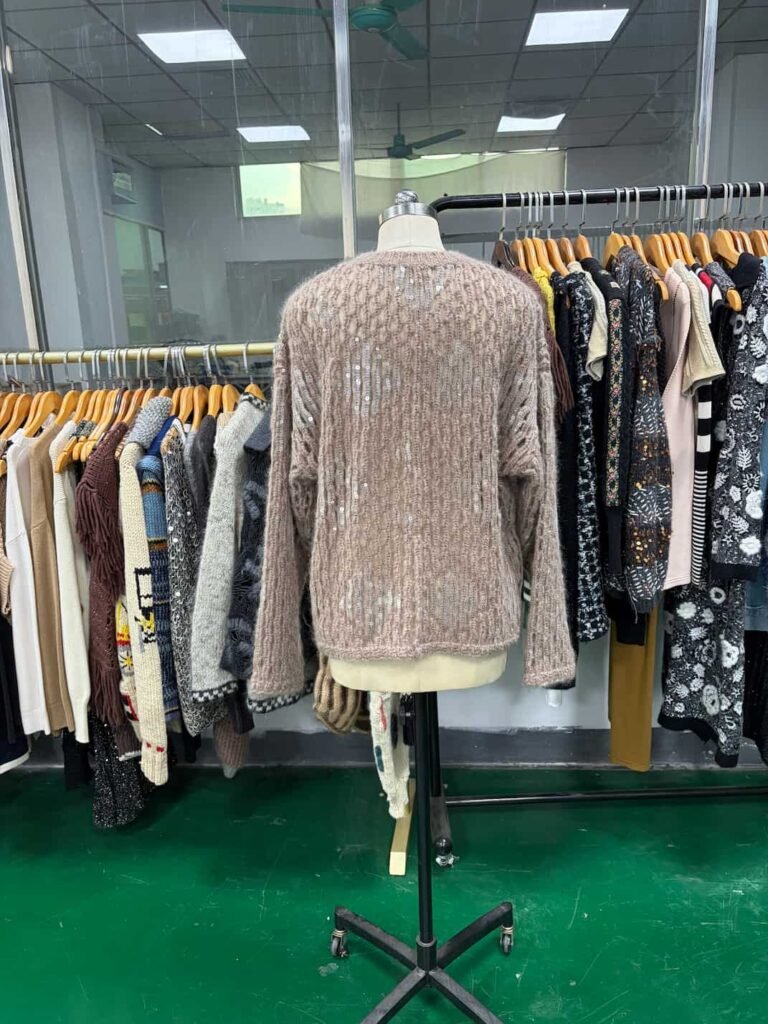 Back view of beige sweater featuring knits embroidery and sequin