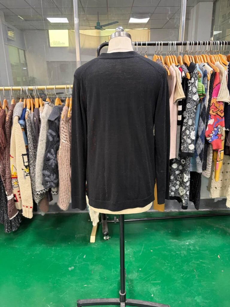 Back view of black floral print knit cardigan