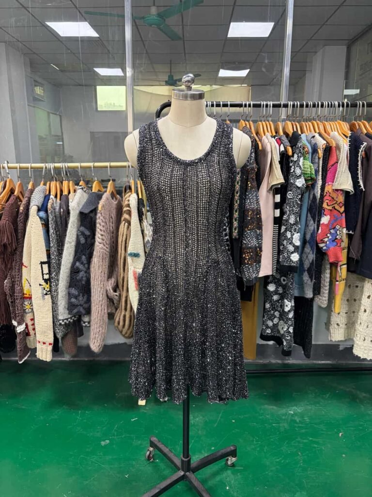 Elegant black knit dress with sequin embellishments