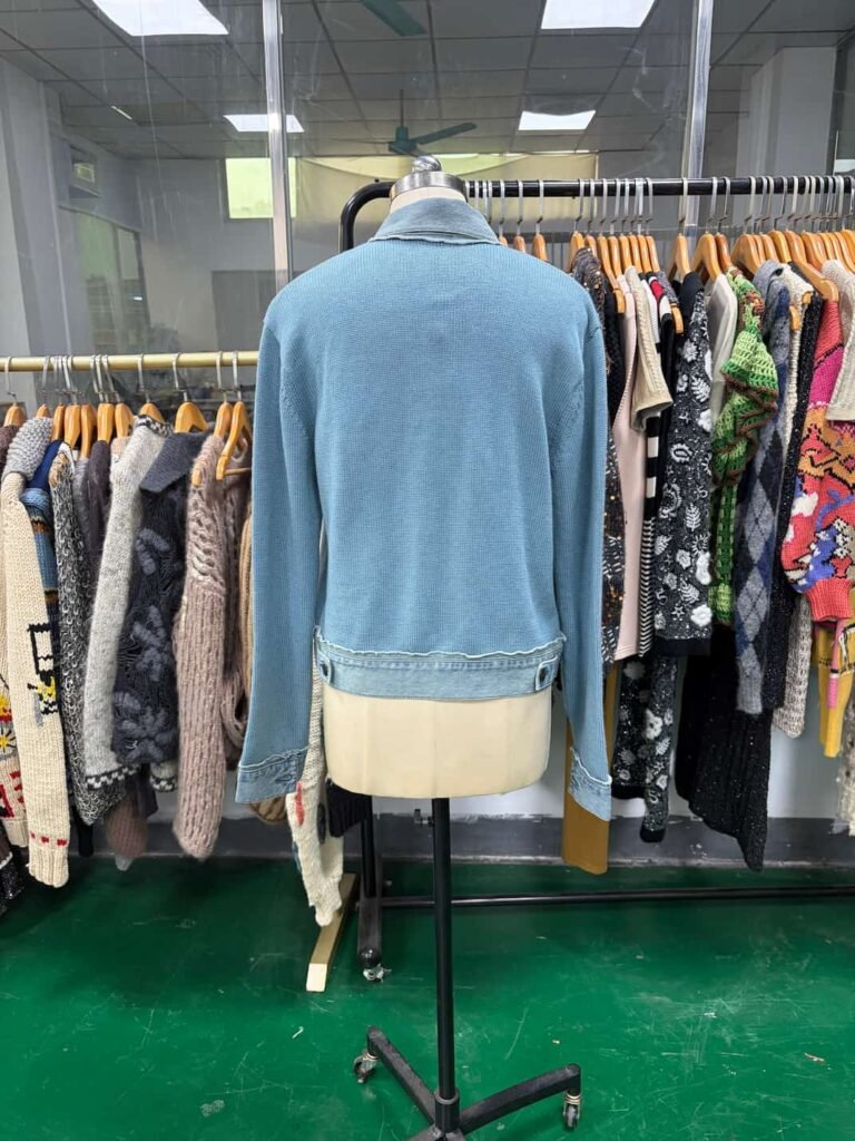 Back view of blue hybrid hand-knit and denim jacket