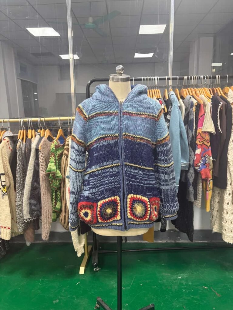 Artisanal chunky knitwear craftsmanship featuring thick, textured stitches for luxury fashion brands.