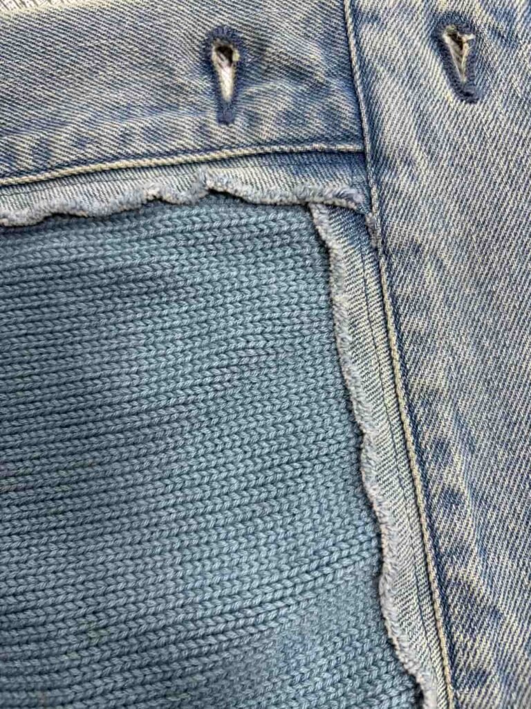 Close-up texture of blue denim knit fabric hybrid material