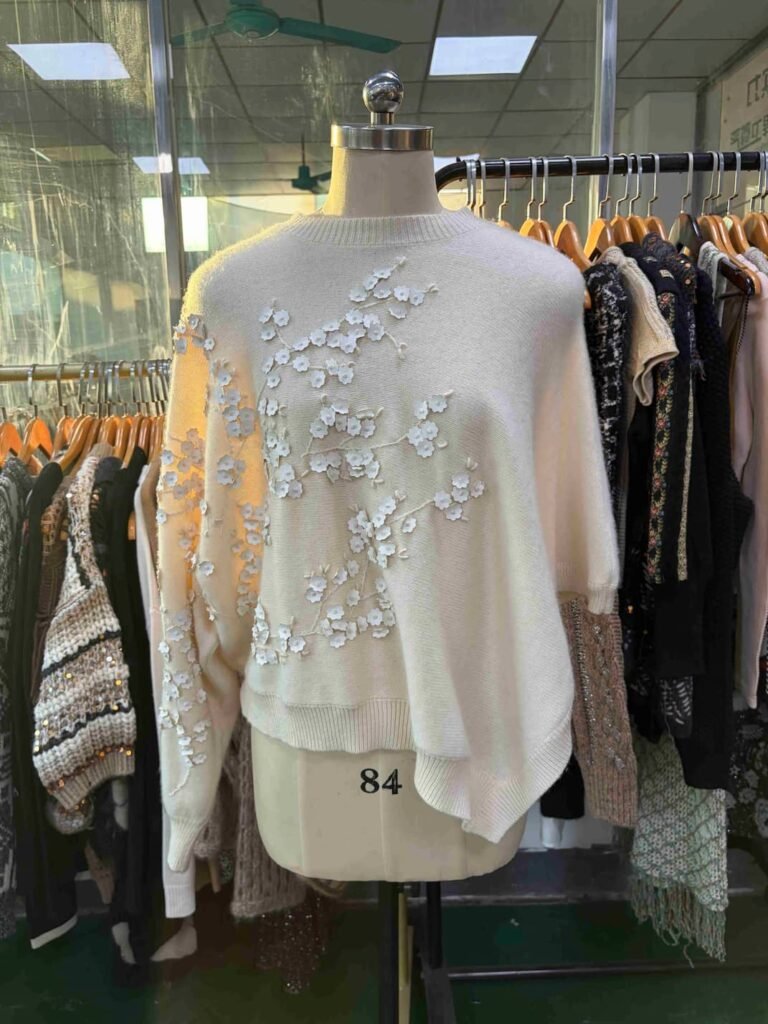 Off-white luxury cashmere sweater with floral appliqué