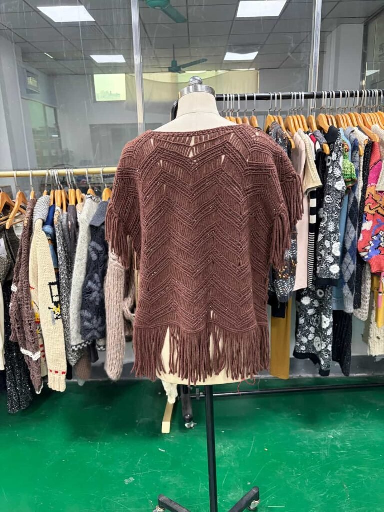 Back view of fringed handmade knit top