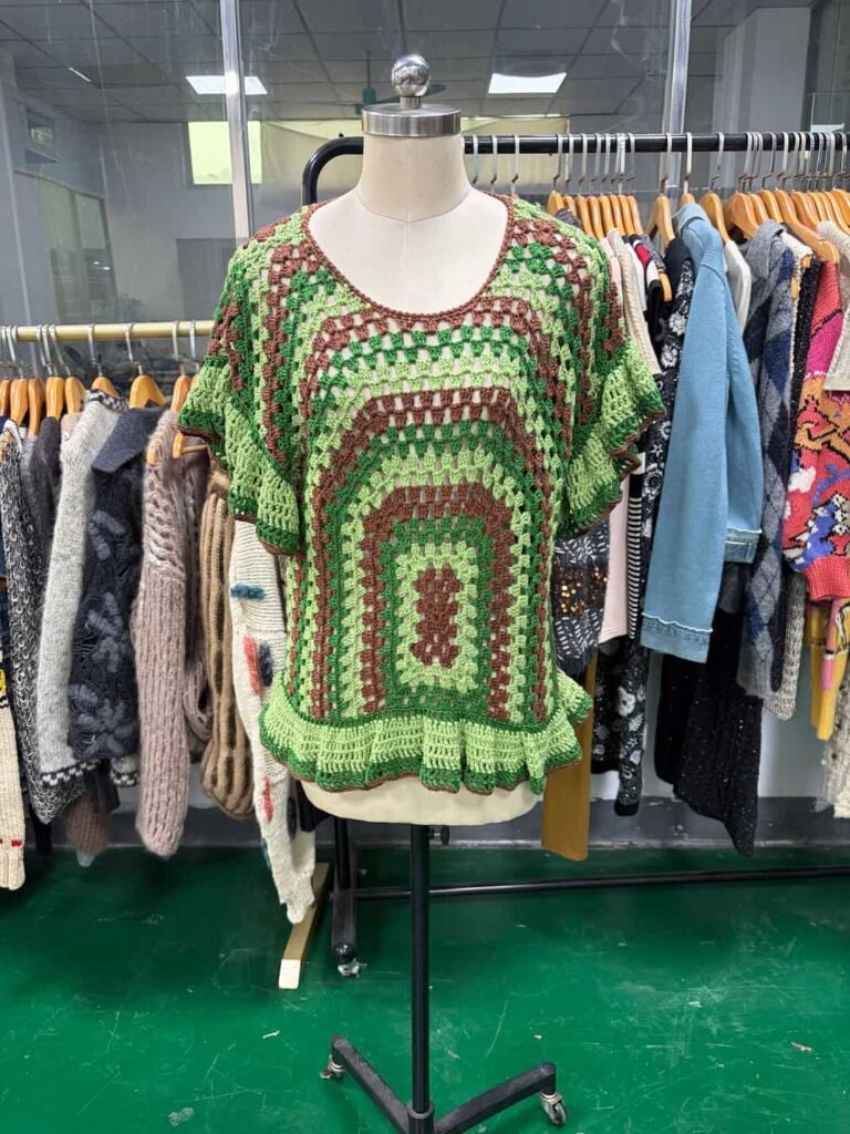 Front view of handmade green and brown granny square crochet top