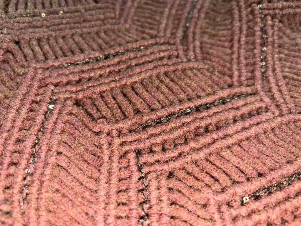 Macro view of sequin chevron knit pattern