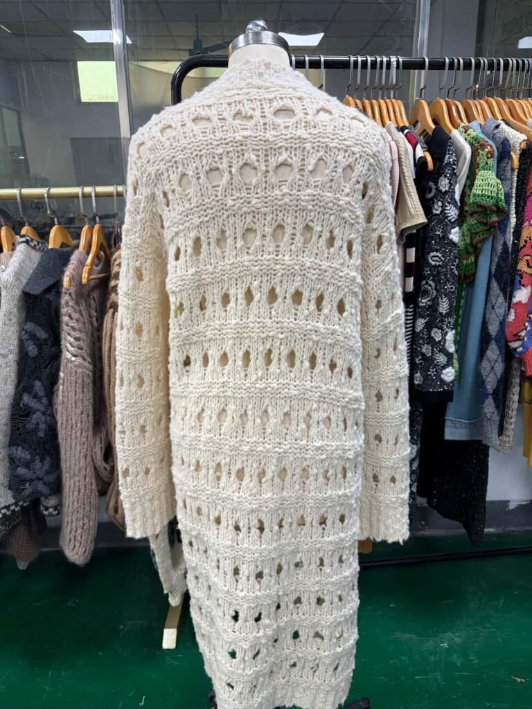 Back view of white handmade knit cardigan
